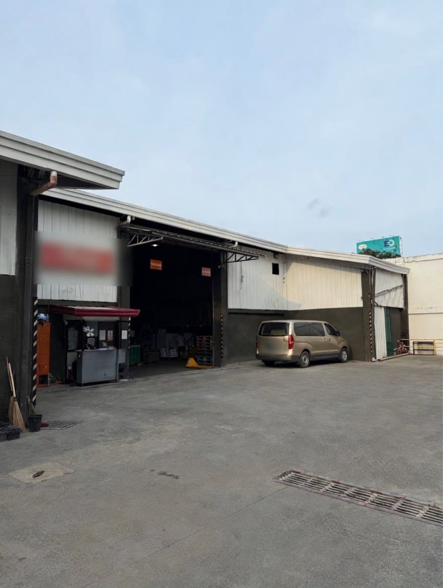Concrete loading yard and service bay beside the warehouse
